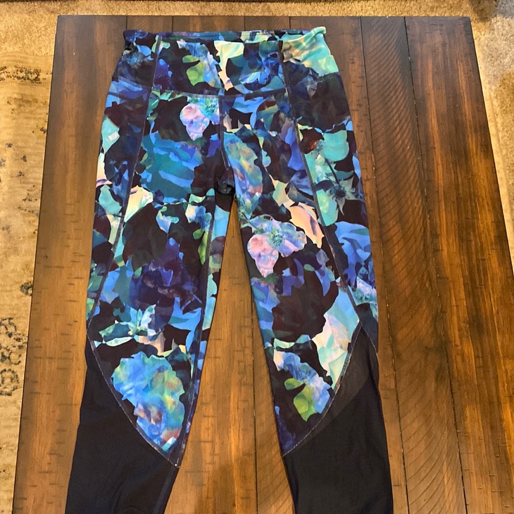 Athleta leaf multi colored tights in size medium.